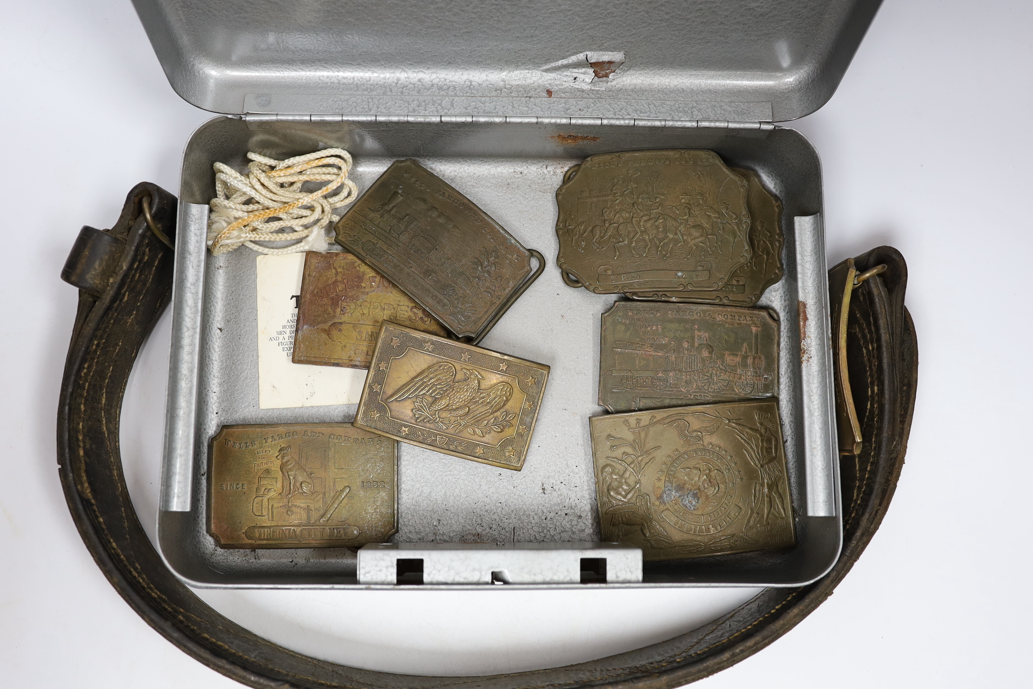 A collection of Wells Fargo and similar belt buckles by Tiffany & Co. Etc.